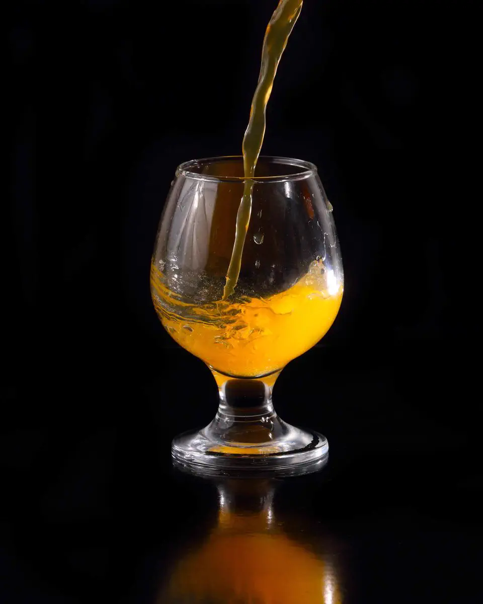 Juice being poured into a glass