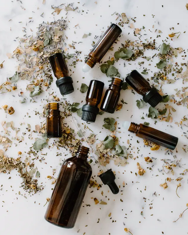 Amber oil bottles with dried botanicals